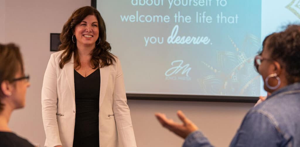 Joyce speaking to attendees of her mental health presentation. 